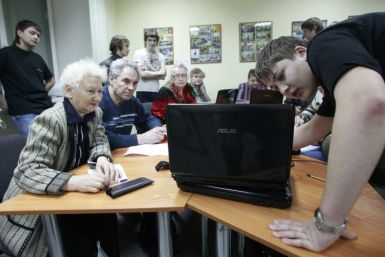 Yevseyev shares his knowledge of a computer with Russian pensioners at Russia's Siberian city of Krasnoyarsk