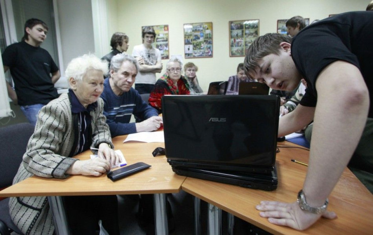 Yevseyev shares his knowledge of a computer with Russian pensioners at Russia's Siberian city of Krasnoyarsk