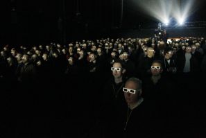 Audience wearing 3D glasses watches a Kraftwerk show