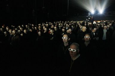 Audience wearing 3D glasses watches a Kraftwerk show