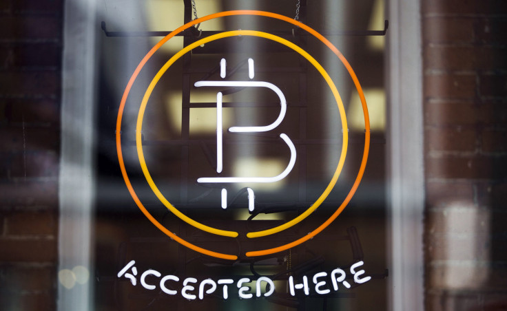 Bitcoin logo, digital cryptocurrency accepted by pro sports teams and  satellite networks
