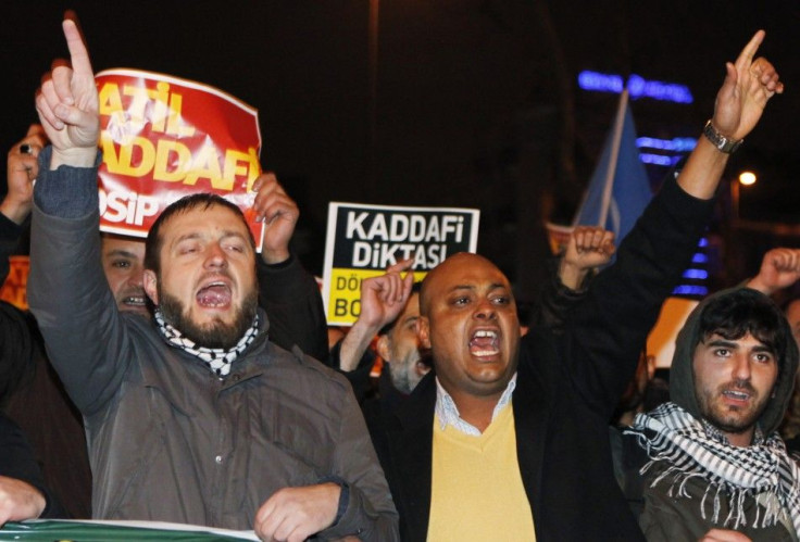 Demonstrators shout slogans as they protest against the regime of Libya's leader Muammar Gaddafi outside the Libyan consulate in Istanbul