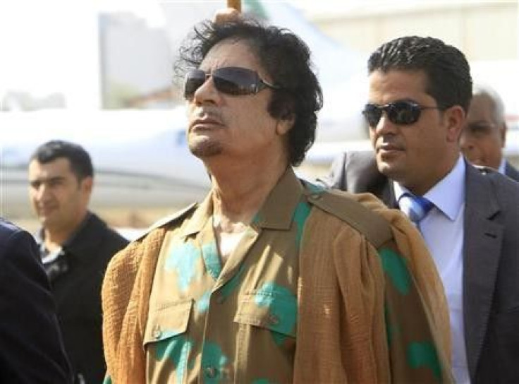 Libyan leader Muammar Gaddafi arrives at Khartoum airport, Sudan, 