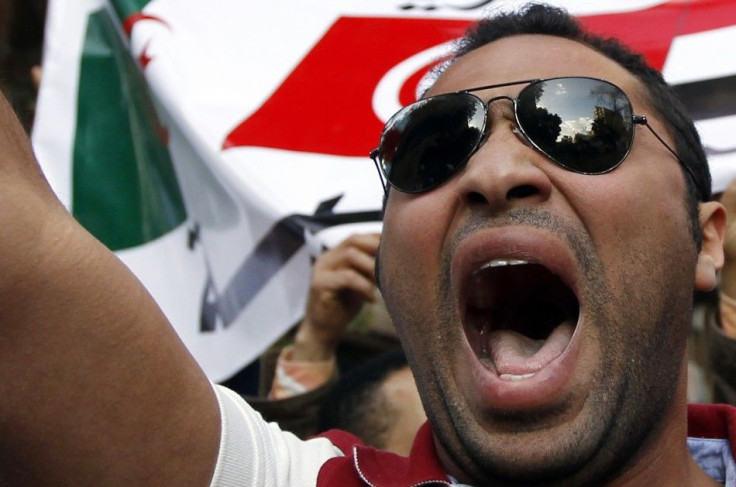 A Libyan protester shouts slogans against Libyan leader Muammar Gaddafi during a demonstration outside the Libyan Embassy in Cairo