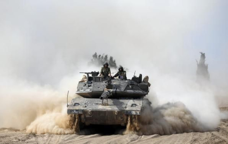 Israeli soldiers atop tank