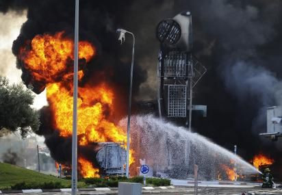 Israeli firefighters fight missile fire