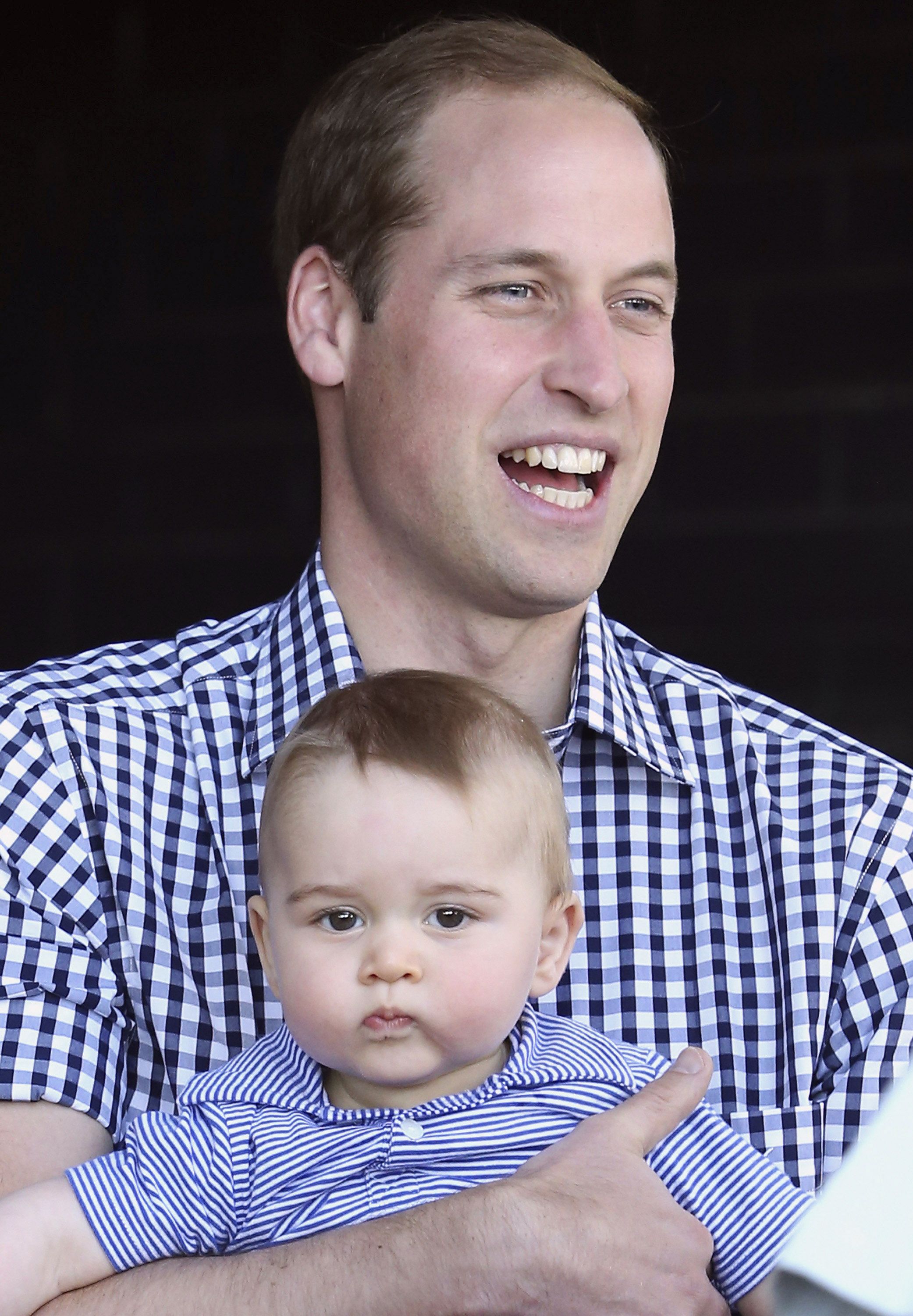 Prince William holds Prince George