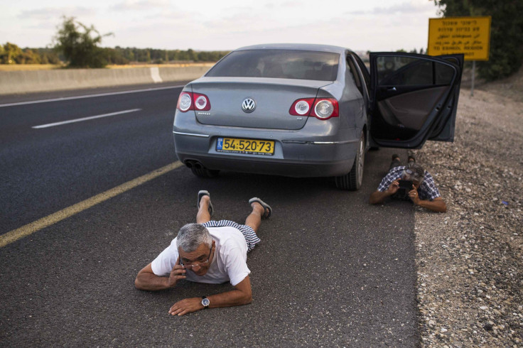 Israeli taking cover