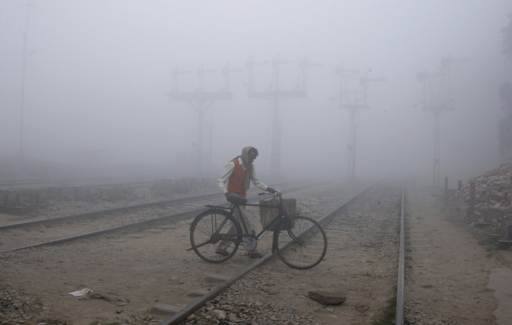 man crossing railway track