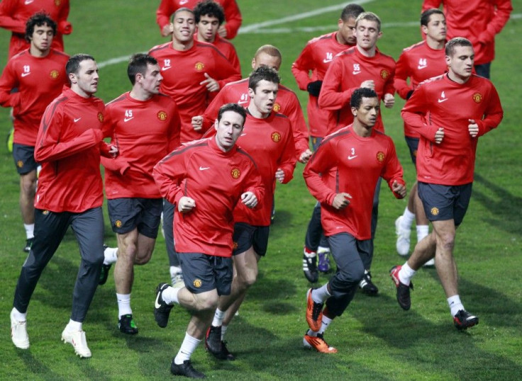 Manchester United's players run during a training session in Marseille.