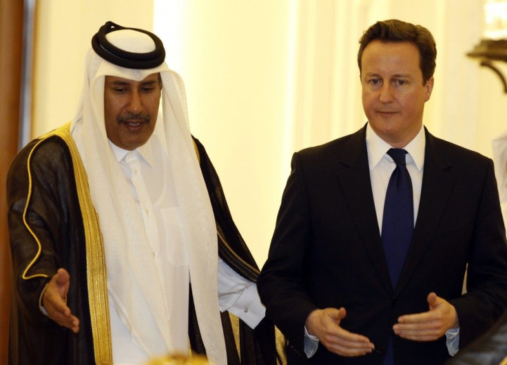 British Prime Minister David Cameron arrives for a news conference with Qatar's Prime Minister Sheikh Hamad bin Jassim bin Jaber al-Thani