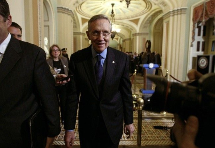 Senate Majority Leader Harry Reid smiles as he makes his way from the Old Senate Chamber after a closed session about the new START treaty on Capitol Hill in Washington December 20, 2010.