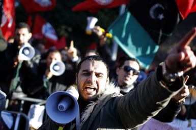 A protester shouts slogans during a demonstration against Libyan leader Muammar Gaddafi in front of Libya's embassy in Rome