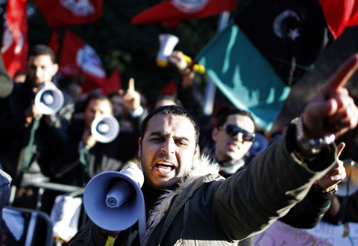 A protester shouts slogans during a demonstration against Libyan leader Muammar Gaddafi in front of Libya's embassy in Rome
