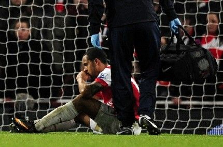 Walcott hurts in ankle in the second half