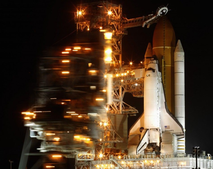 The space shuttle Discovery is prepared for launch as the Rotating Service Structure is rolled back at launch pad 39A, at the Kennedy Space Center in Cape Canaveral