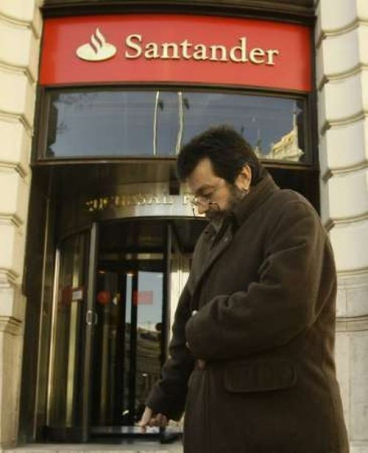 A man walks past a Santander bank branch in central Madrid December 15, 2008