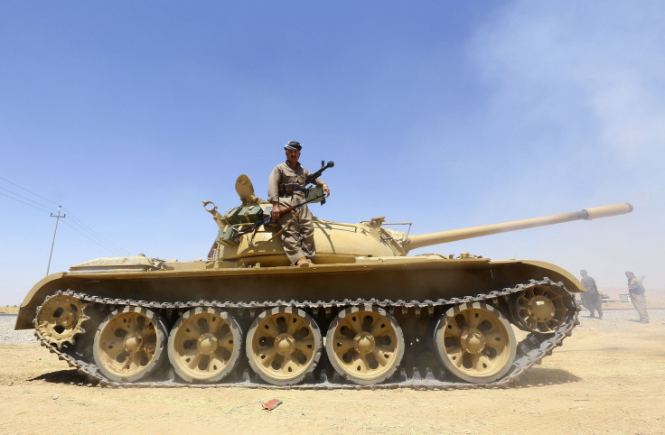 Kurdish troops on tank