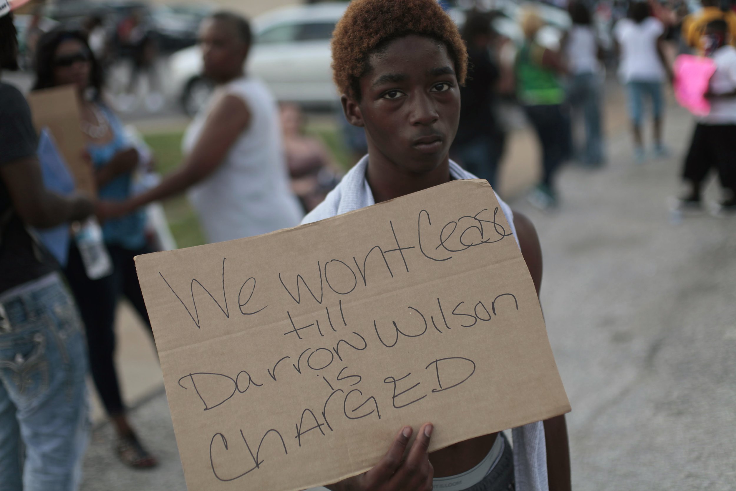 Ferguson demonstrator holds sign