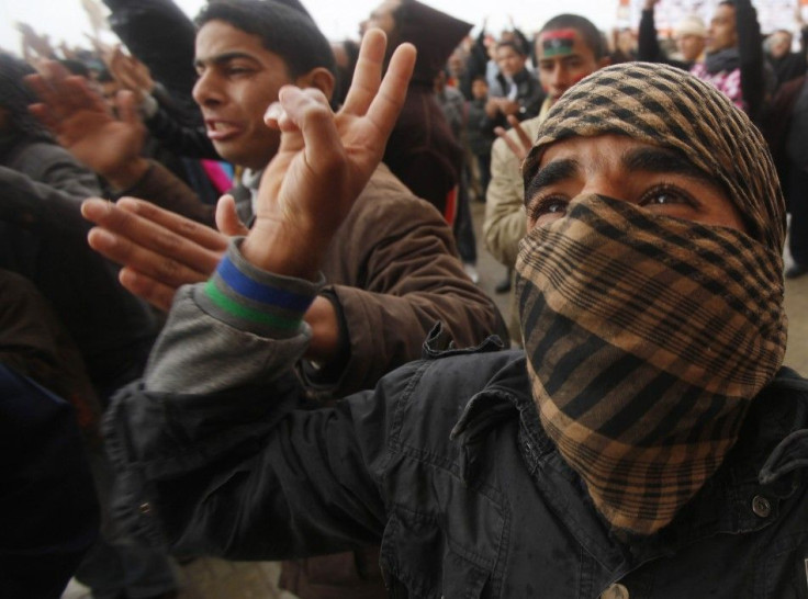 Anti-Gaddafi protesters shout slogans during a protest in Benghazi