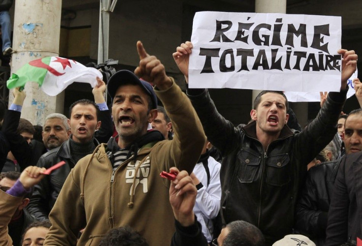 Anti-government protesters chant slogans during a demonstration in Algiers
