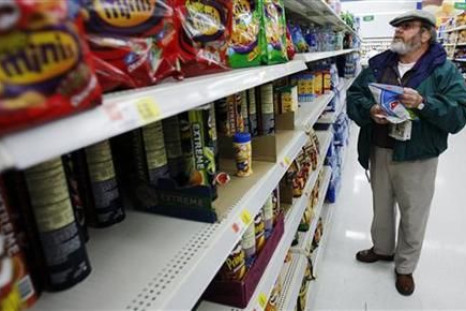 Michael Lipsitz picks out a bag of chips while grocery shopping at the WalMart in Crossville