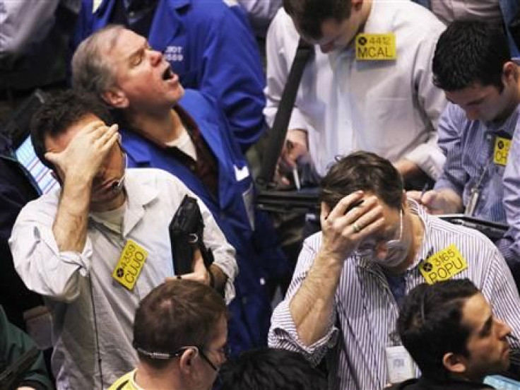 Traders work in the oil options pit on the floor of the New York Mercantile Exchange in New York City