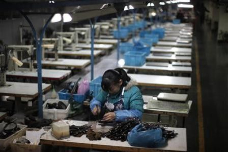 A laborer works at an empty shoe factory in the city of Wenzhou, in Zhejiang province February 18, 2011.