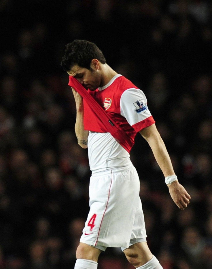 Arsenal's captain Cesc Fabregas walks off the pitch as he is substituted with an injury during their English Premier League soccer match against Stoke City at the Emirates Stadium in London.