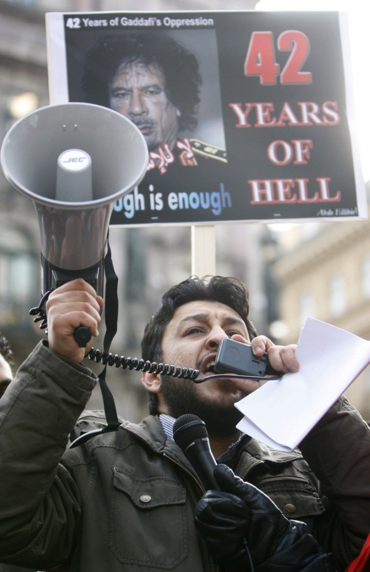 A protestor shouts during a demonstration in solidarity with the anti-government protests in Libya, in Vienna