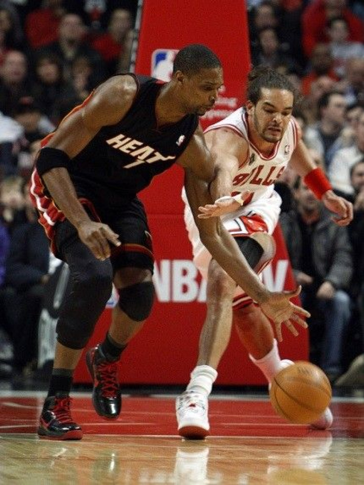 Chris Bosh appears to exaggerate the contact by Carlos Boozer