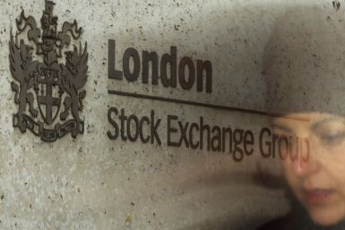 A City worker passes the Stock Exchange in London