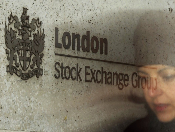 A City worker passes the Stock Exchange in London