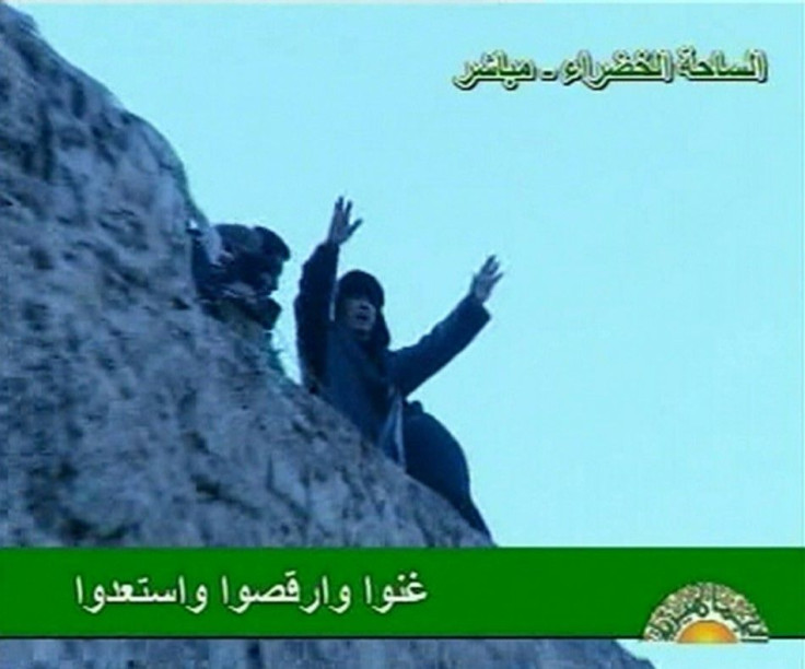 Libyan leader Muammar Gaddafi addresses his supporters in Tripoli's Green Square in this still image taken from video