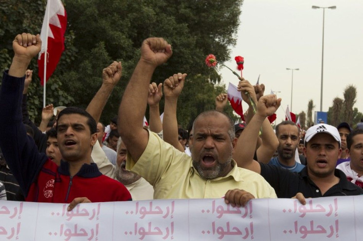 Protesters shout slogans during a demonstration in Manama
