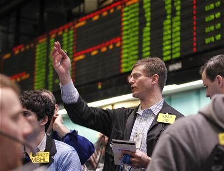 Traders work in the oil options pit on the floor of the New York Mercantile Exchange in New York