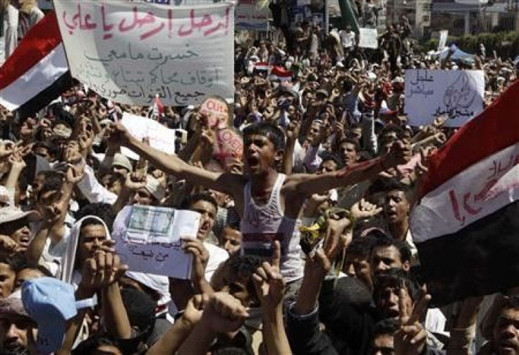Protesters take part in an anti-government rally outside Sanaa University