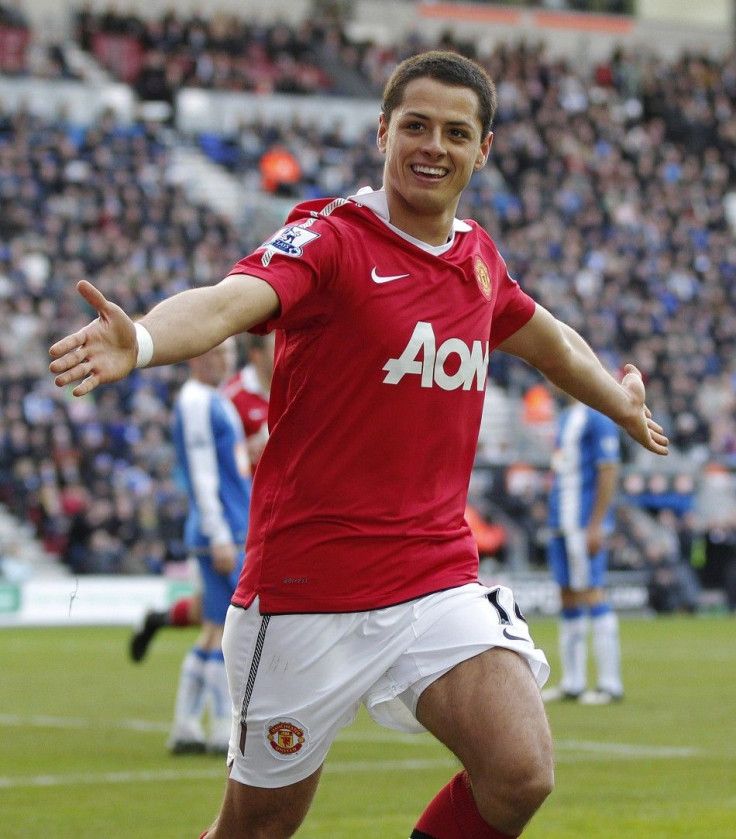 Manchester United's Hernandez celebrates after scoring during their English Premier League soccer match against Wigan Athletic at the DW Stadium in Wigan.