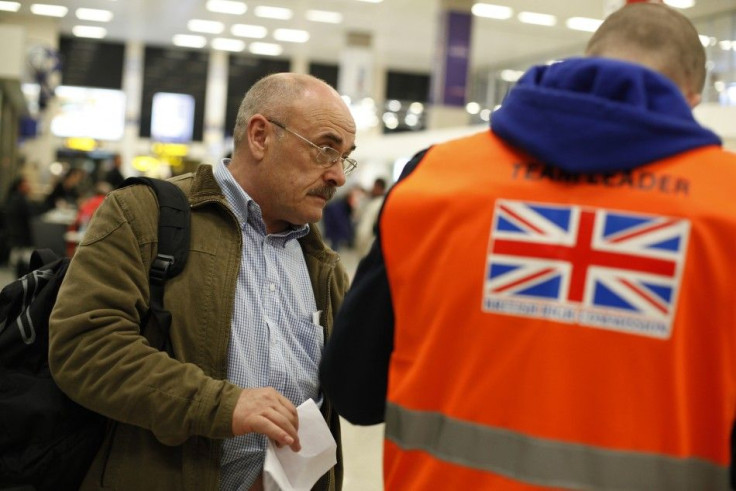 British evacuee is welcomed by a British High Commission representative after arriving at Malta International Airport outside Valletta