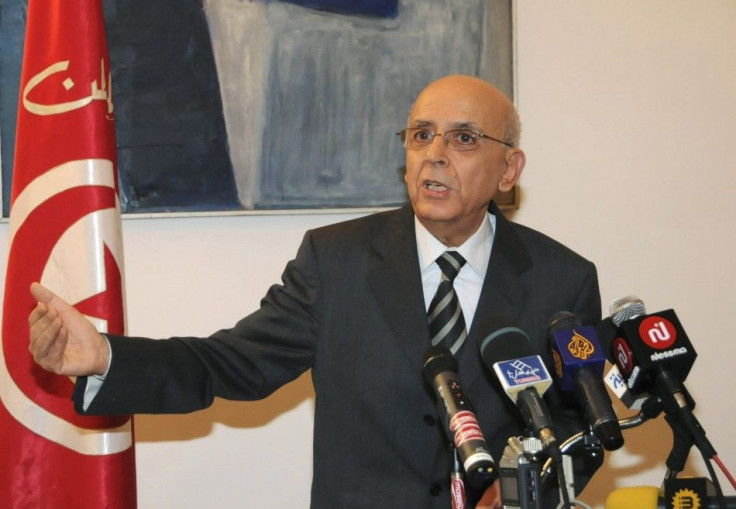 Tunisia's Prime Minister Mohamed Ghannouchi gestures during a news conference in Tunis