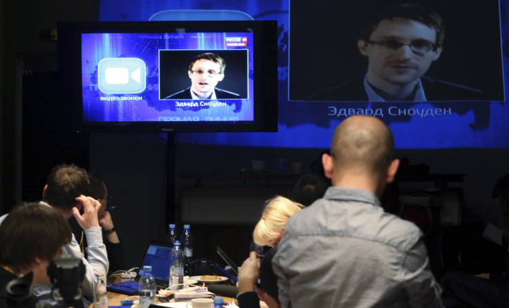 journalists listen to Snowden