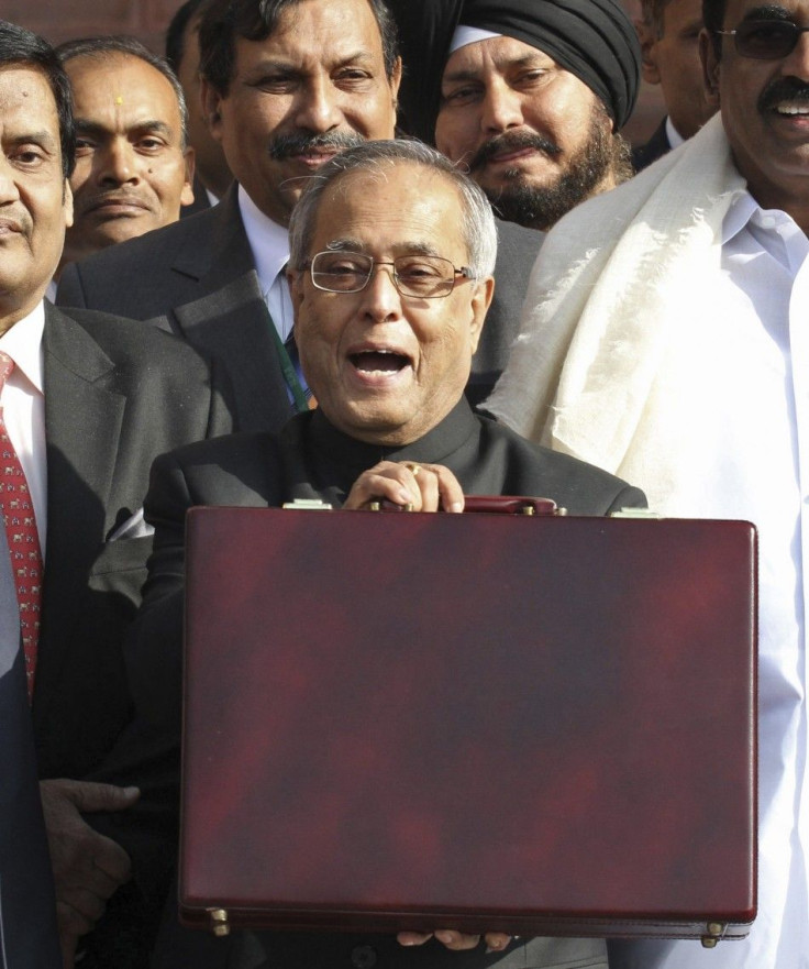 India's Finance Minister Pranab Mukherjee speaks as he leaves his office to present the 2011/12 federal budget in New Delhi February 28, 2011.