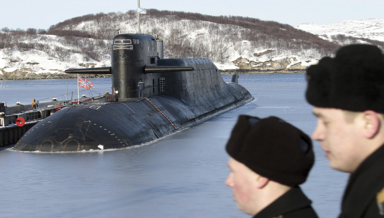 Russian Sailors Look On With Submarine In The Background