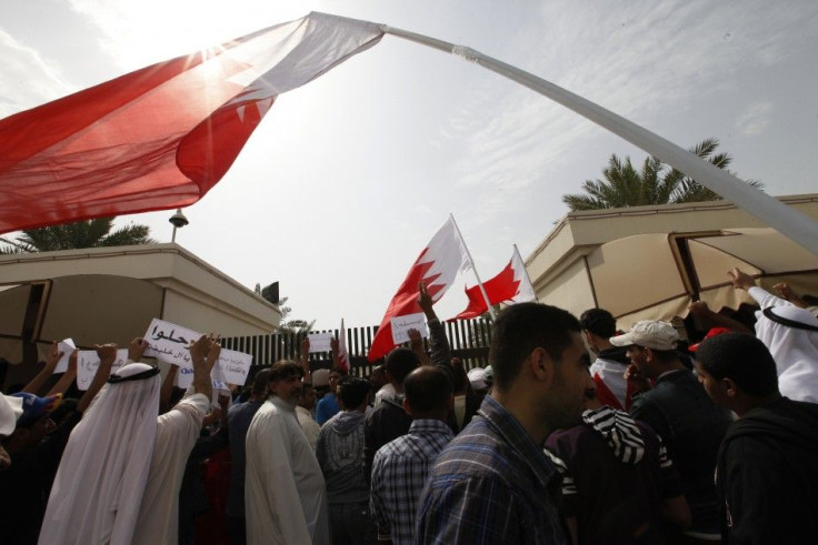 Bahraini Shi'ite men shout anti-government slogans as they protests outside the parliament in Bahraini capital of Manama, February 28, 2011. 