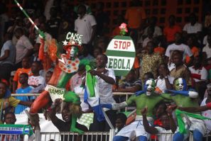 Ivory Coast Supporter Holds Up A Sign About Ebola