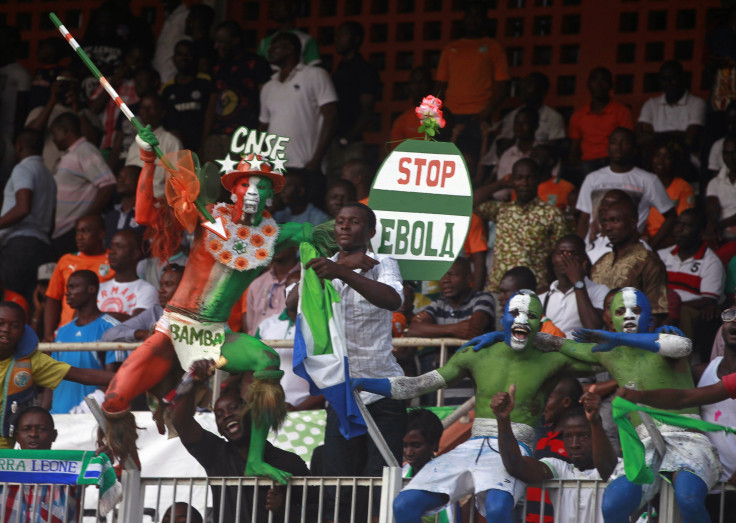 Ivory Coast Supporter Holds Up A Sign About Ebola