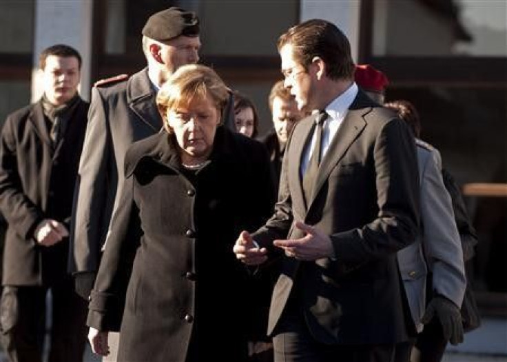 German Chancellor Angela Merkel and Defence Minister Karl-Theodor zu Guttenberg 