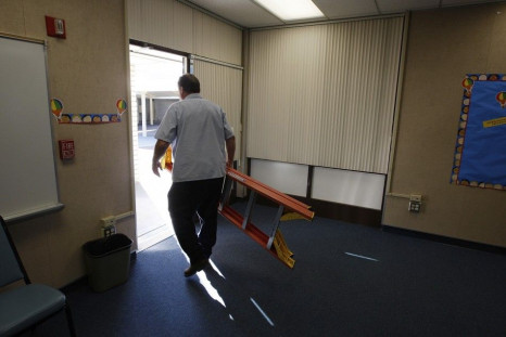Maintenance worker Kent Burrows makes repairs at former Telechron Elementary School, which became the administrative offices of the South Whittier School District after budget problems forced the school to close this year, in Whittier, California,