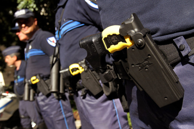 Police pose with Tasers