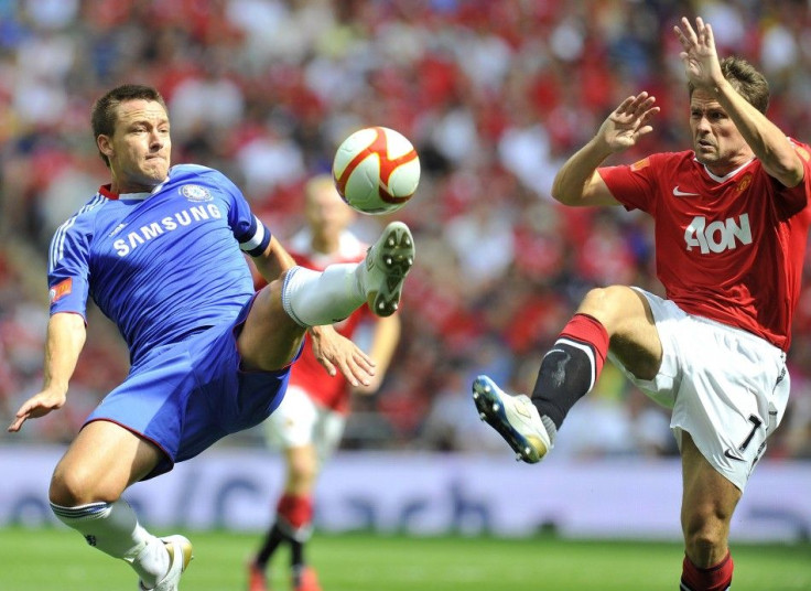 Chelsea's Terry and Manchester United's Owen challenge for the ball during their English Community Shield soccer match in London